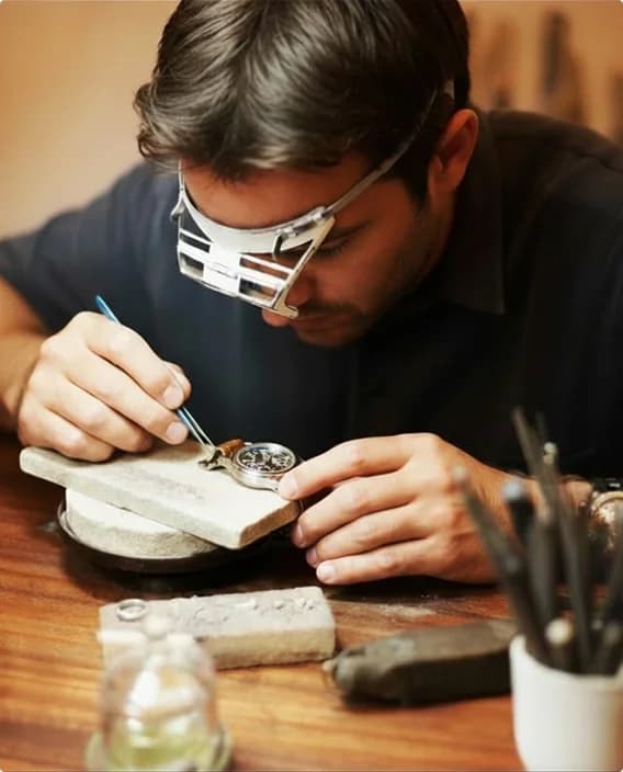 Watchmaker carrying out a repair